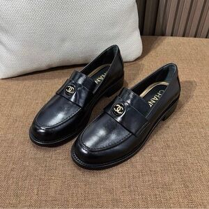 CHANEL Black Loafers with Gold Emblem